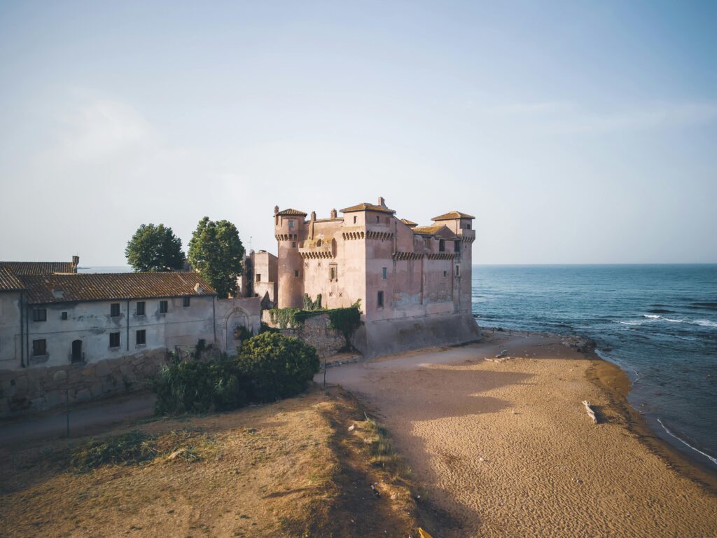 Aerial view of Santa Severa Castle on the scenic Italian coastline.